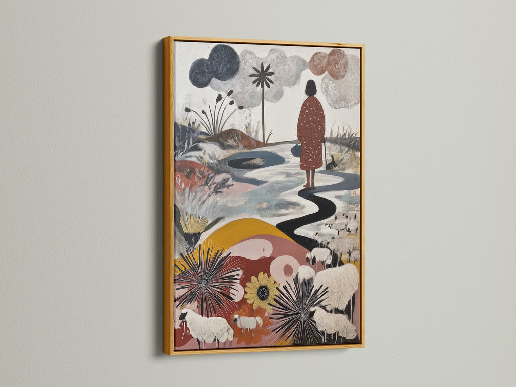 Artwork with a gold frame is displayed on a white wall. The artwork features a figure walking along a winding path. Sheep graze in a field of flowers. The gold frame adds a touch of luxury. Consider our gold frame for your artwork.