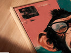 A close-up angled view shows the canvas print in a floating frame. The funny monkey artwork is a pop art masterpiece. The quirky chimp with glasses stands out in this view. A great conversation piece for any room. This floating frame enhances the artwork's modern appeal.