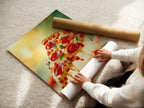 A woman is carefully rolling a fine art poster paper. The paper showcases vibrant pizza artwork. This image highlights the care and quality. It showcases the creation of a beautiful food photography print. Ideal for culinary art enthusiasts and restaurant owners.