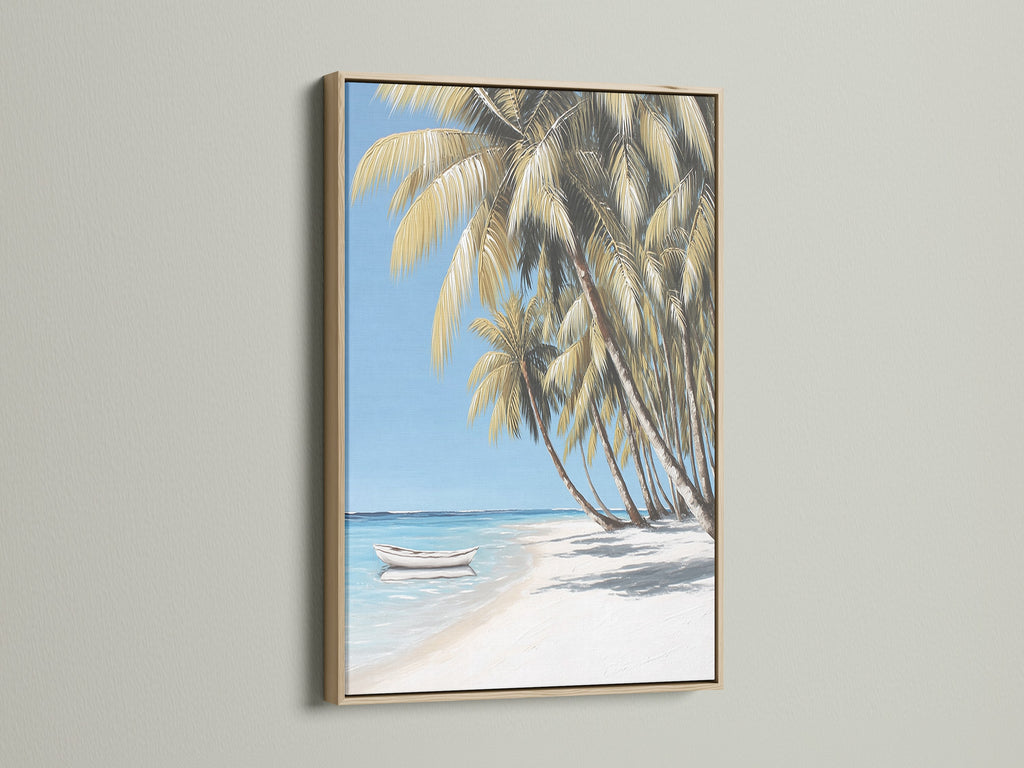 Tropical beach canvas art in an oak frame. The artwork shows palm trees on a white sand beach. A boat sits in the clear blue water. Ideal coastal artwork to bring a summer vibe to your home or office.