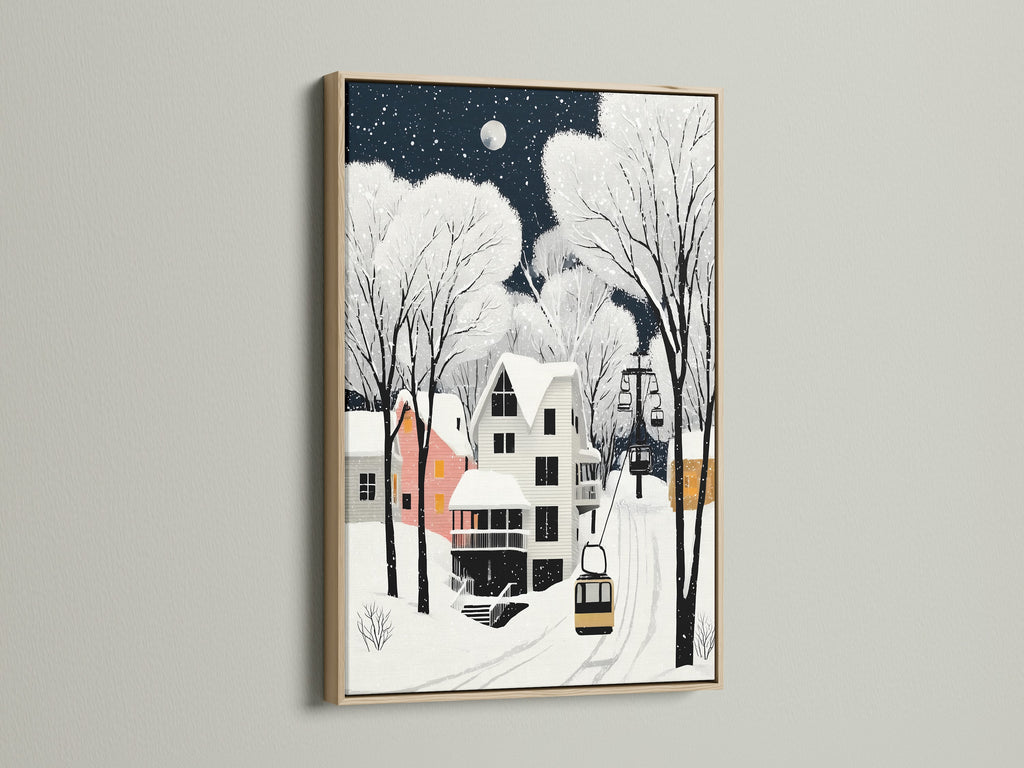 Winter Village art in an oak frame graces a white wall. This snow scene print adds a cozy touch to any room. It's perfect Scandinavian decor for homeowners renters and interior designers alike. 