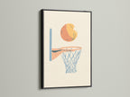 Artwork featuring a basketball above a net is displayed in a black frame. The sleek black frame provides a bold and contemporary feel. It makes the colors in the artwork pop.