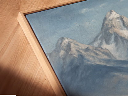 A close-up angled view reveals a canvas print of mountain and highland cattle in a floating frame. This modern framing style elevates the rustic farmhouse wall art. The artwork enhances the countryside feel. Ideal for homeowners and renters seeking unique wall decor.