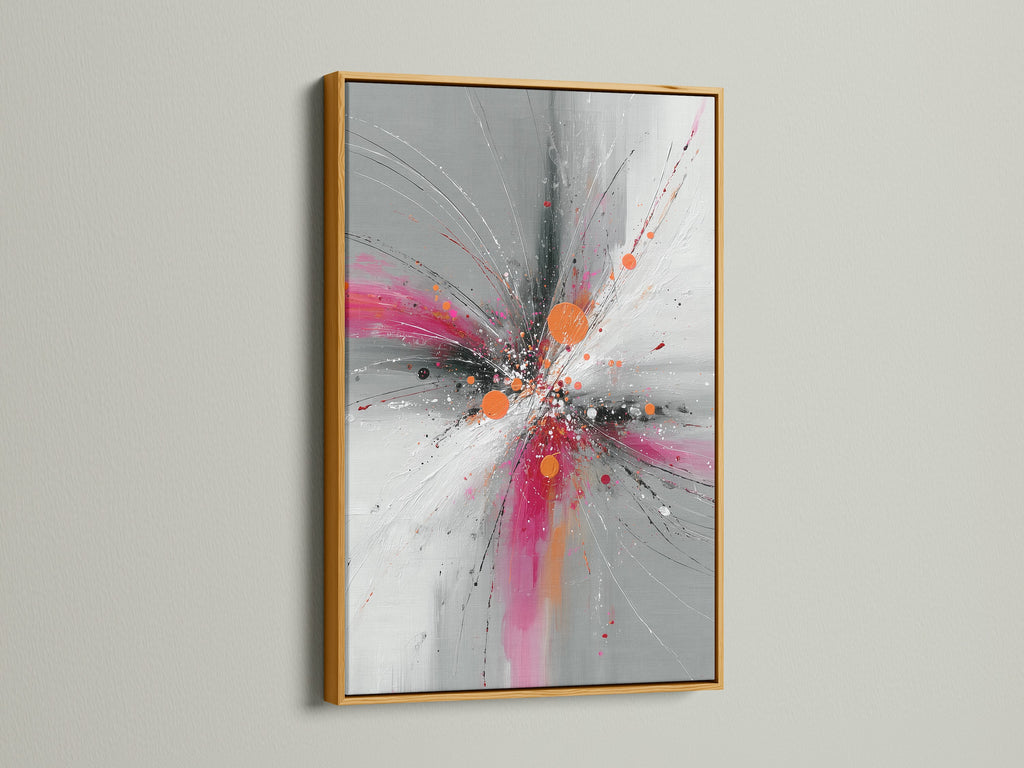 Abstract Burst artwork showcased in a luxurious gold frame. The pink orange and gray colors burst to life in this contemporary artwork. This explosion print adds a touch of glamour to any space. Perfect for elevating your living room or office decor. The gold frame exudes elegance.