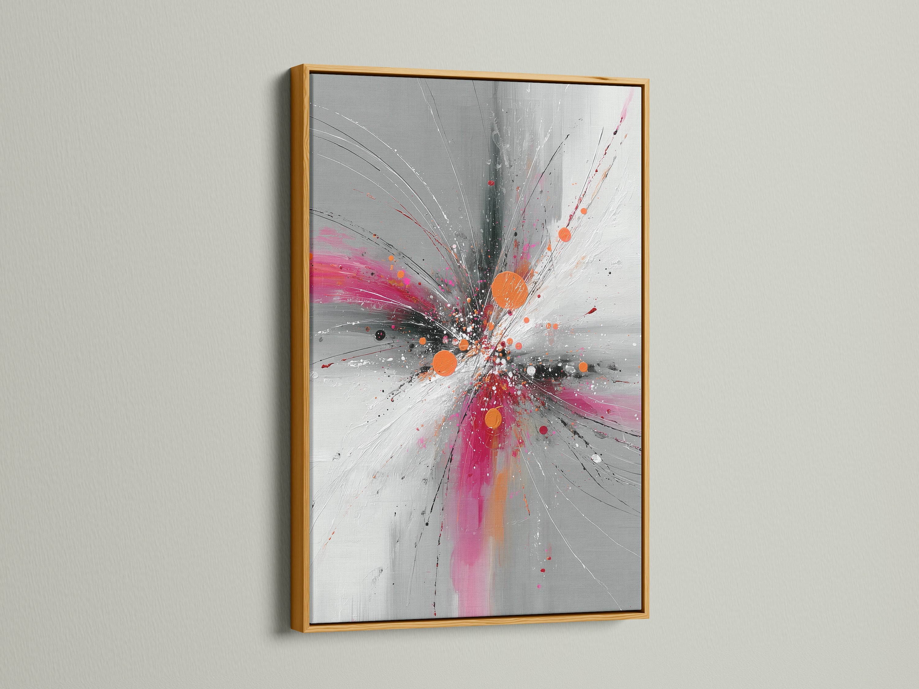 Abstract Burst artwork showcased in a luxurious gold frame. The pink orange and gray colors burst to life in this contemporary artwork. This explosion print adds a touch of glamour to any space. Perfect for elevating your living room or office decor. The gold frame exudes elegance.