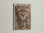 A striking cheetah artwork in a white frame. This wildlife art print adds a touch of elegance to any room. The contrasting frame highlights the big cat artwork. Ideal for enhancing your home or office decor.