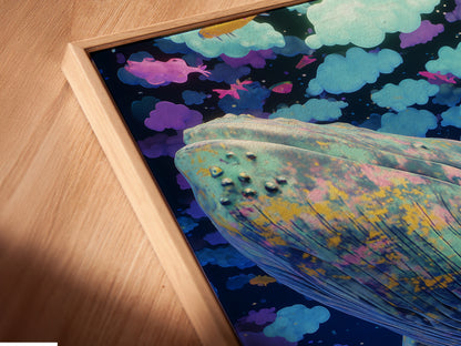 This is an angled close up of a canvas print in a floating frame. The Whale Canvas Print shows dreamy surreal wall art. It is perfect for kids room decor. Add fantasy with sea life prints and blue purple art.