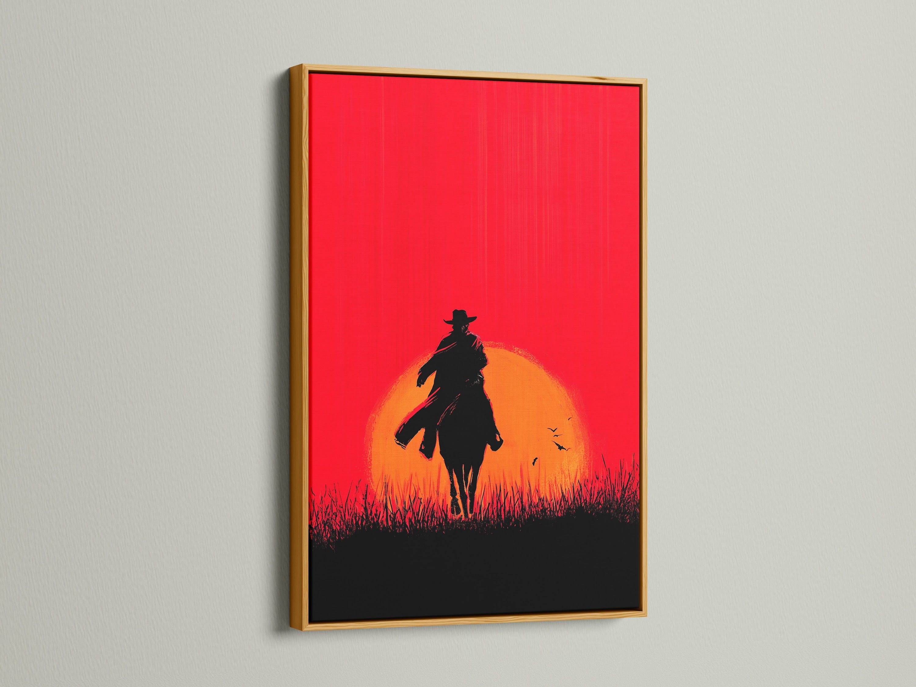 Cowboy Sunset Canvas Print with gold frame. The red orange silhouette of a horse rider adds a touch of western flair. This artwork is perfect for man caves offices or any space needing rustic wall decor. This is a stunning sunset wall art piece.