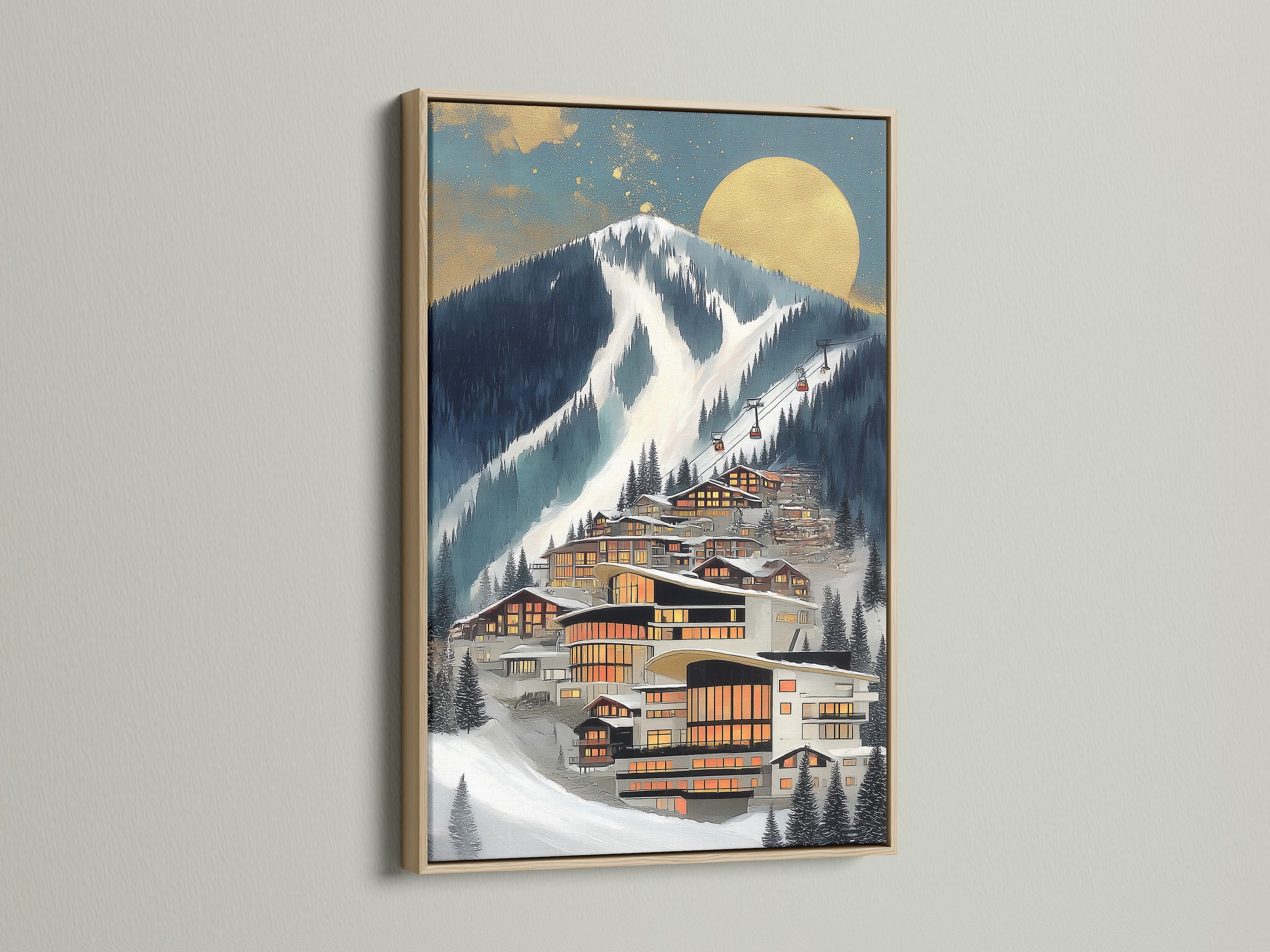 A framed Alpine Village artwork is displayed. The frame is oak. The artwork is a modern mountain ski resort scene. It features a contemporary snow scene. Ideal wall decor for a bedroom or living room.
