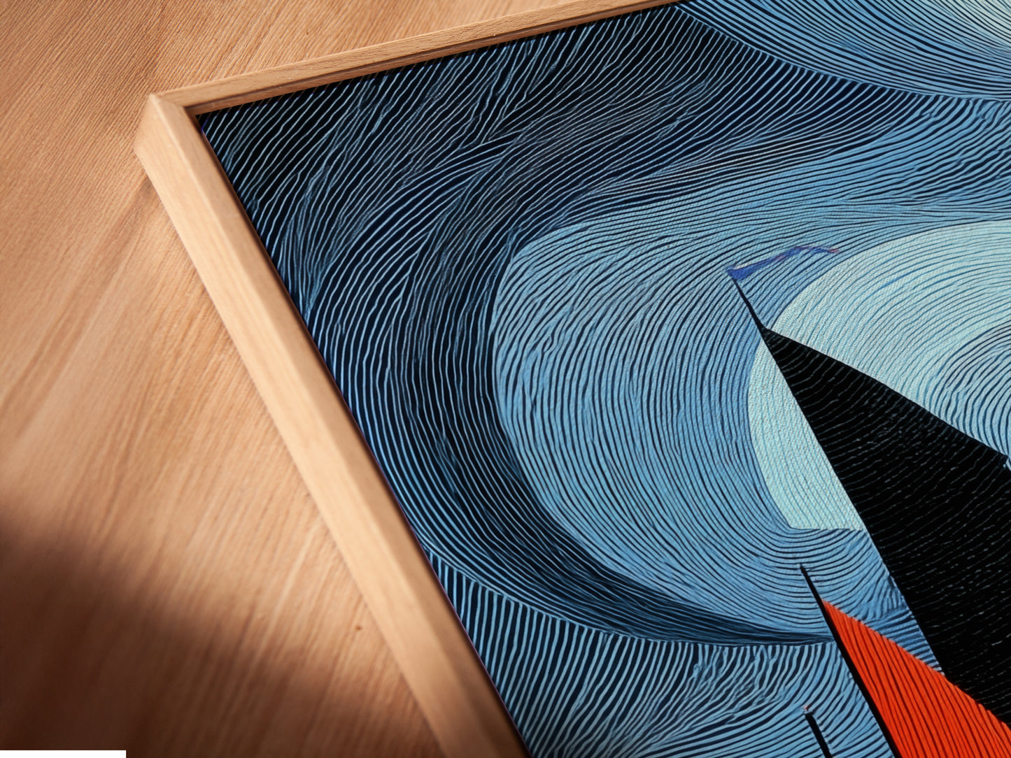 Close up angled view of a canvas print in a floating frame. The sailboat artwork features vibrant colors and abstract nautical theme. The floating frame adds a modern touch enhancing the art's depth and visual appeal as coastal wall art.