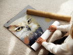 A woman carefully rolls a fine art poster paper featuring an owl artwork print. The modern wildlife canvas art is being prepared for display. The contemporary bird artwork will soon enhance a space with its unique charm. This fine art poster is perfect for any art lover.