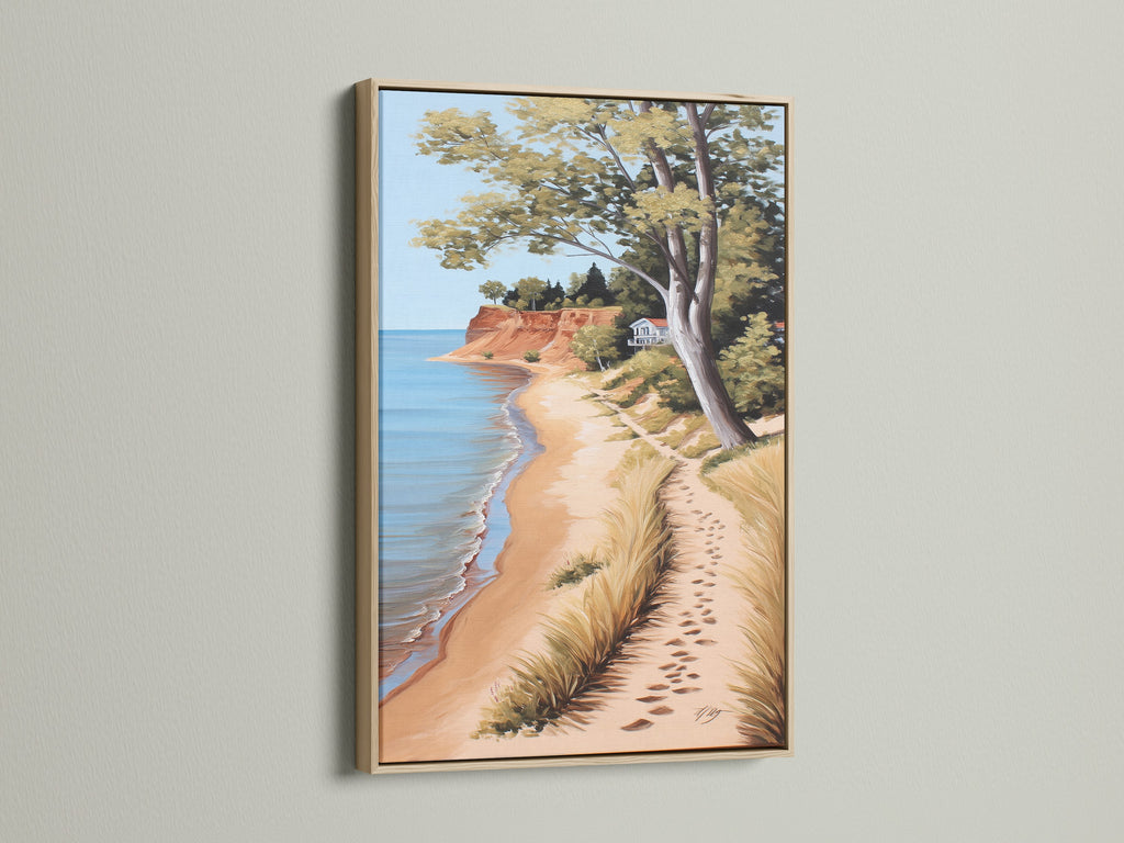 Coastal Beach Canvas Artwork in an Oak Frame. The serene ocean view print showcases a sandy shoreline. Perfect coastal wall art for a beach house. Bring the calming essence of the coast to your living room or bedroom with this beautiful piece.