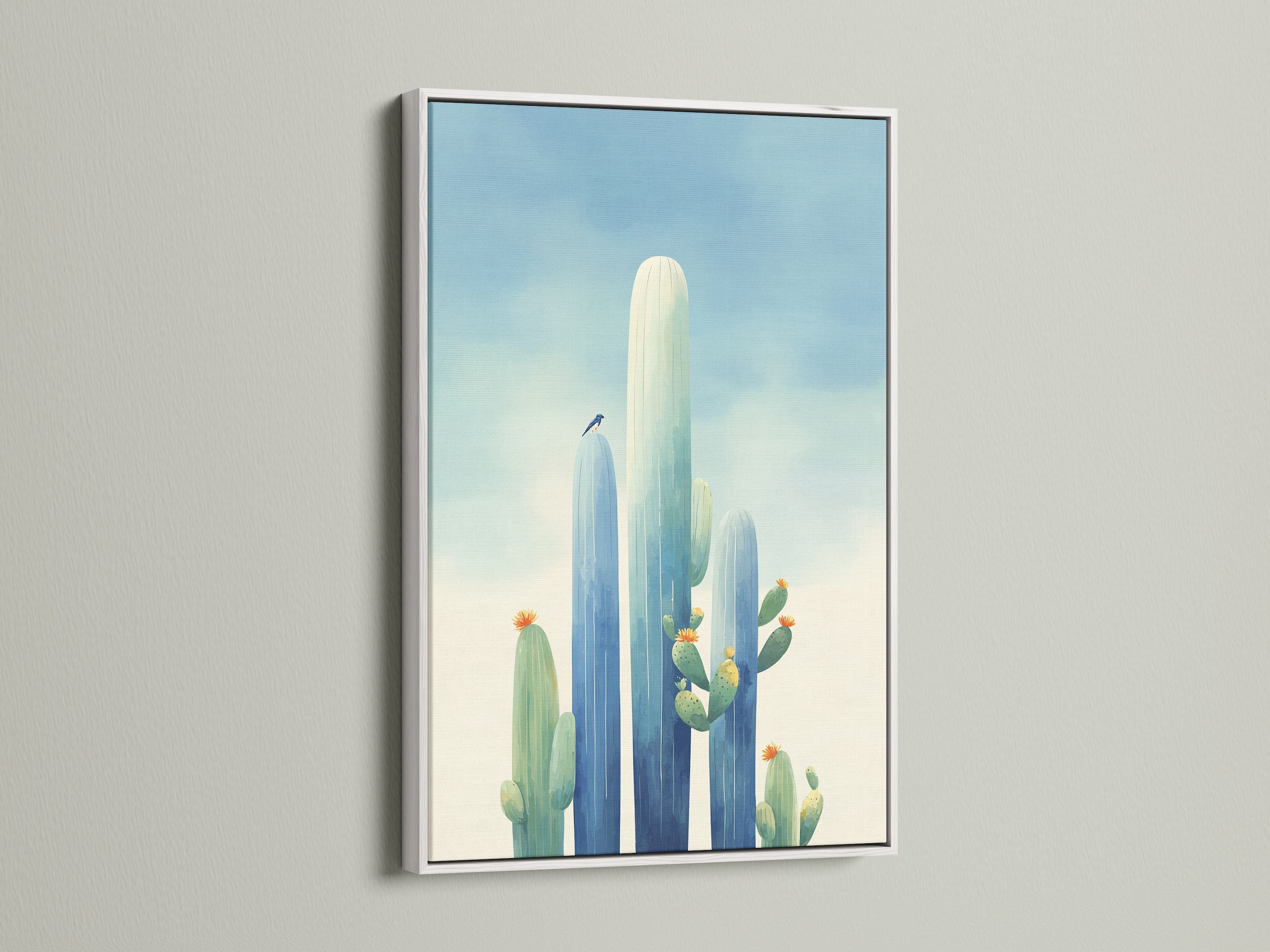 This cactus canvas print features a white frame. It's a stunning piece of southwestern art that complements any decor. The white frame makes the blue art print pop. Enhance your desert decor today.