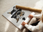 A woman is carefully rolling a fine art poster paper featuring the Gentleman Rabbit artwork. This ensures the print remains in perfect condition. Fine art poster paper is a great option. Ideal for those seeking high-quality prints. The artwork is ready for framing.