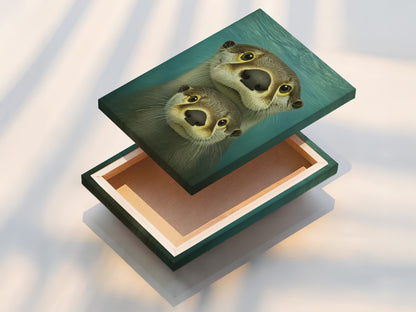 A stretched canvas print displays the endearing otter family artwork. This piece is ready to hang adding a touch of coastal charm to any room. Perfect for nursery art or kids wall art the teal blue hues complement any decor. The animal canvas is vibrant and captivating.