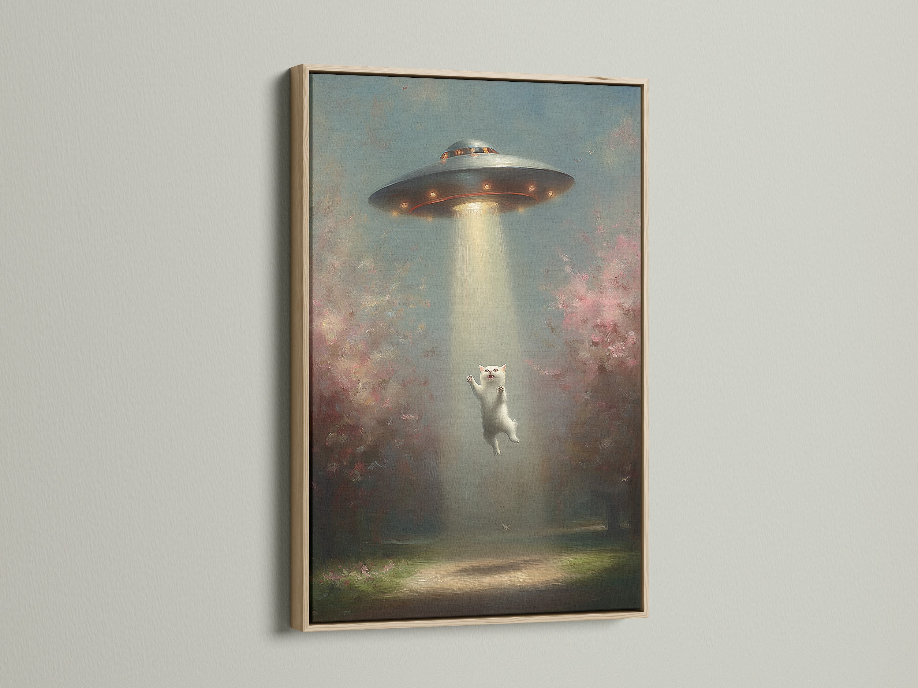 A framed UFO Cat art print with an oak frame. This whimsical alien wall art adds a touch of fantasy to any space. The oak frame enhances the contemporary style.