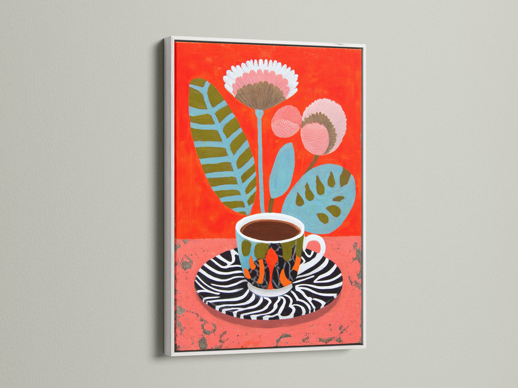 White frame displaying a Coffee Cup Canvas Print. This floral botanical wall art offers a clean contemporary look. The modern still life artwork brightens any space. Perfect for kitchen art.