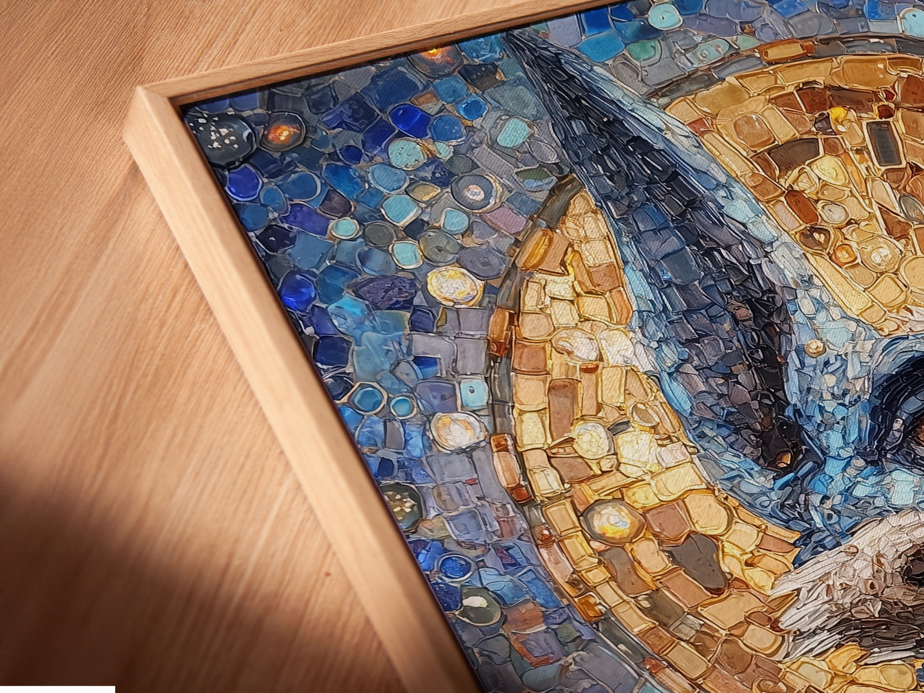 A close-up angled view of a canvas print in a floating frame. The artwork is an Anubis Mosaic. It's an Egyptian God Wall Art piece. It features blue and gold religious imagery. The floating frame adds a modern touch to the artwork.