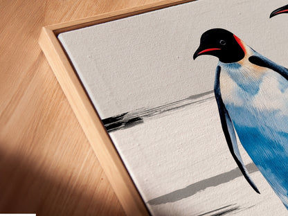 Close-up of a canvas print in a floating frame. The penguin family artwork is beautifully displayed. This coastal wall decor enhances nurseries and living rooms. A unique animal artwork for any home.