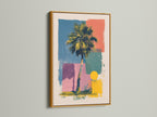 Artwork in a gold frame is mounted on a wall. The artwork includes a palm tree and geometric shapes in multiple colors. The gold frame adds a luxurious and elegant touch. Perfect for adding a piece of framed artwork to your space.