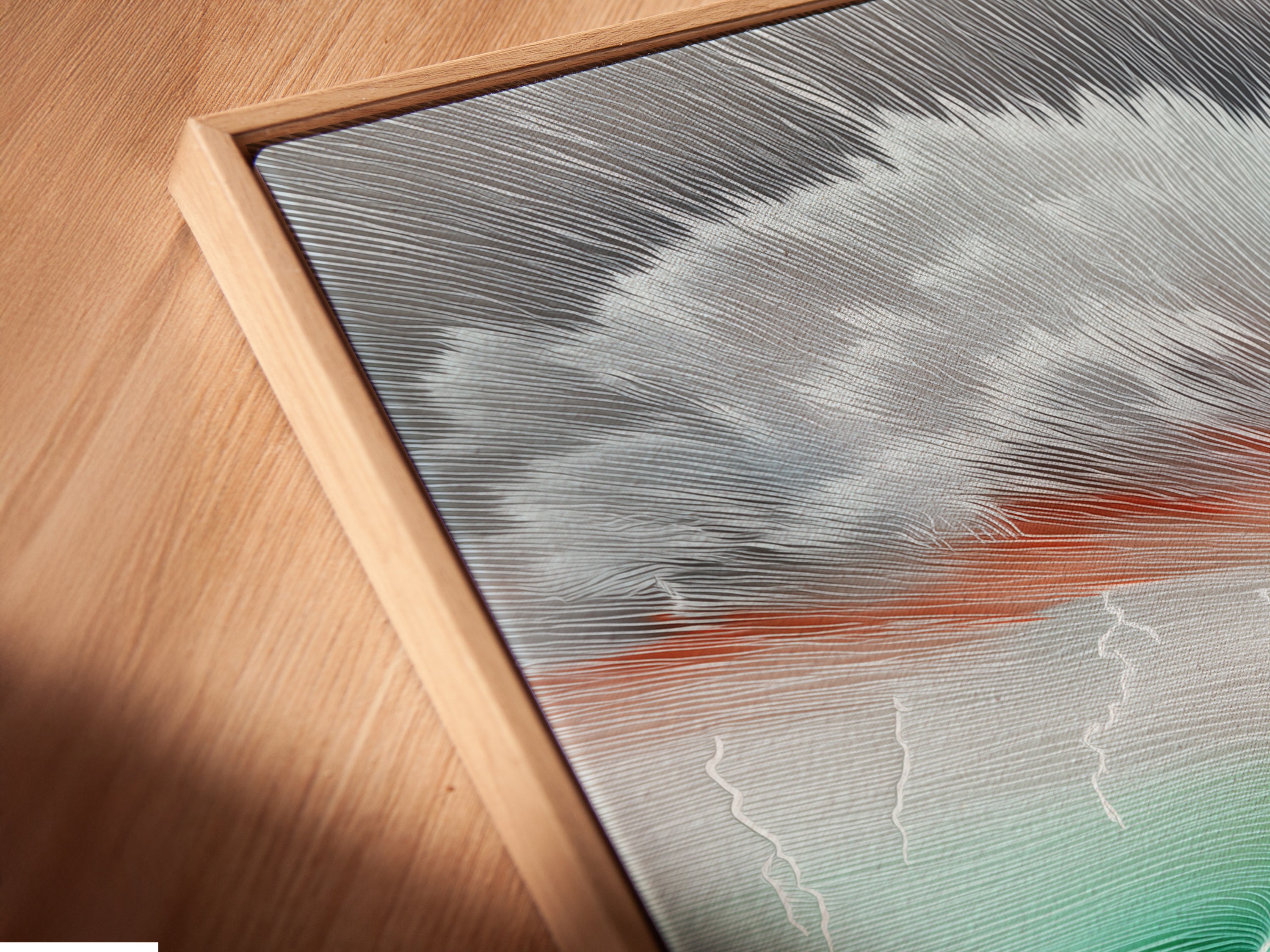 A close-up angled view reveals a canvas print set within a floating frame. The abstract landscape artwork features colorful trees. This modern art piece adds depth and style. Its perfect for living room bedroom or office wall decor.