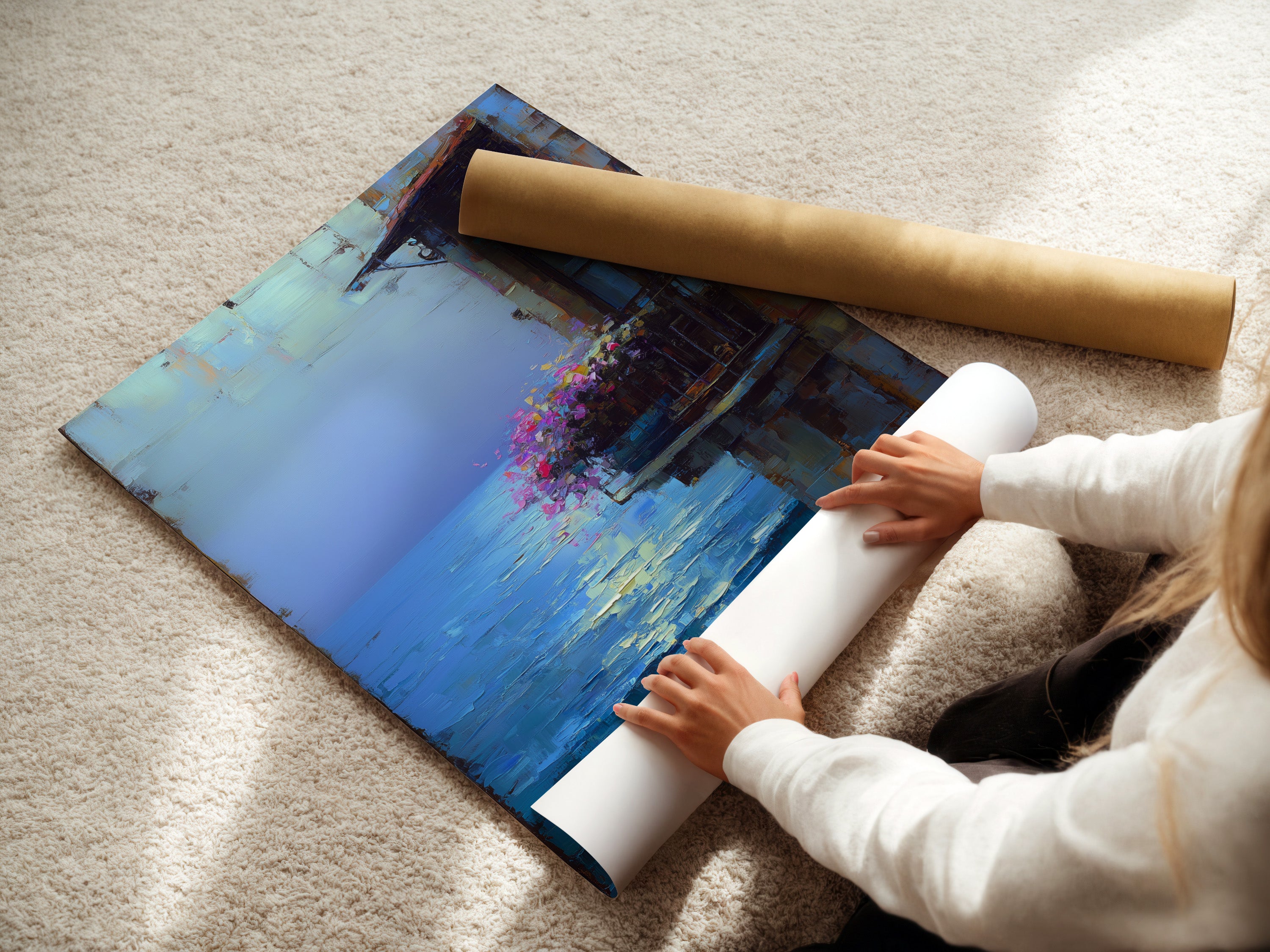 A woman is carefully rolling a fine art poster paper. This shows the care in handling the Mediterranean artwork. The coastal wall art is perfect for seaside boutiques or spas.