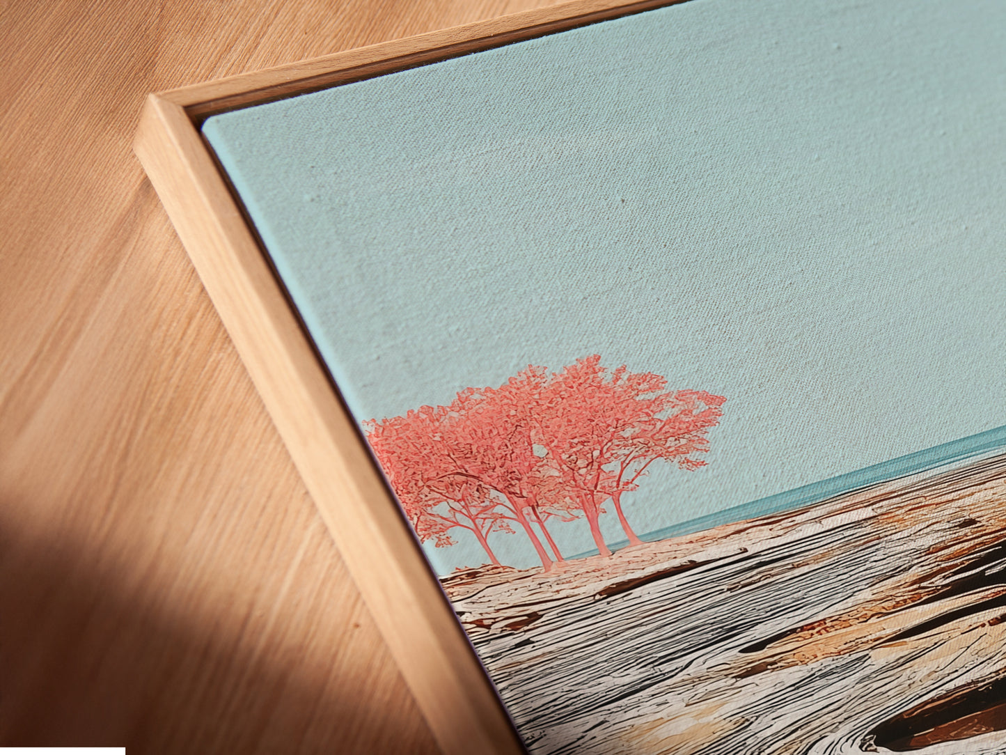 This is a close-up angled view of a canvas print in a floating frame. The artwork displays a serene coastal seascape. The floating frame enhances its modern minimalist appeal. This artwork is ideal for creating a calming atmosphere. It suits bedrooms spas and offices.