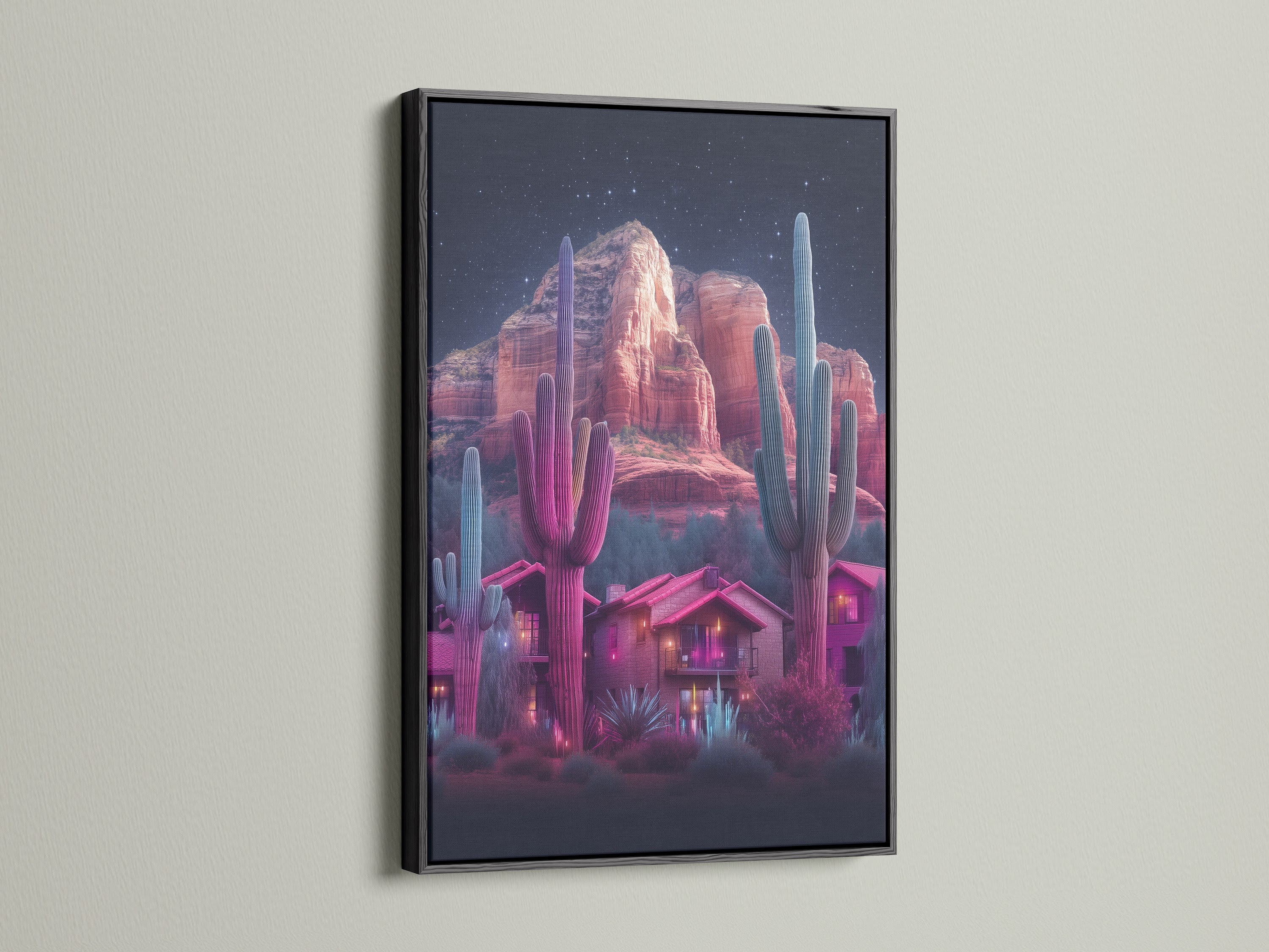Neon cactus artwork featuring a desert landscape inside a black frame. The artwork showcases a southwestern scene with vibrant pink and teal hues. This Arizona art print adds a touch of southwest style to your walls. It is ideal for modern decor.