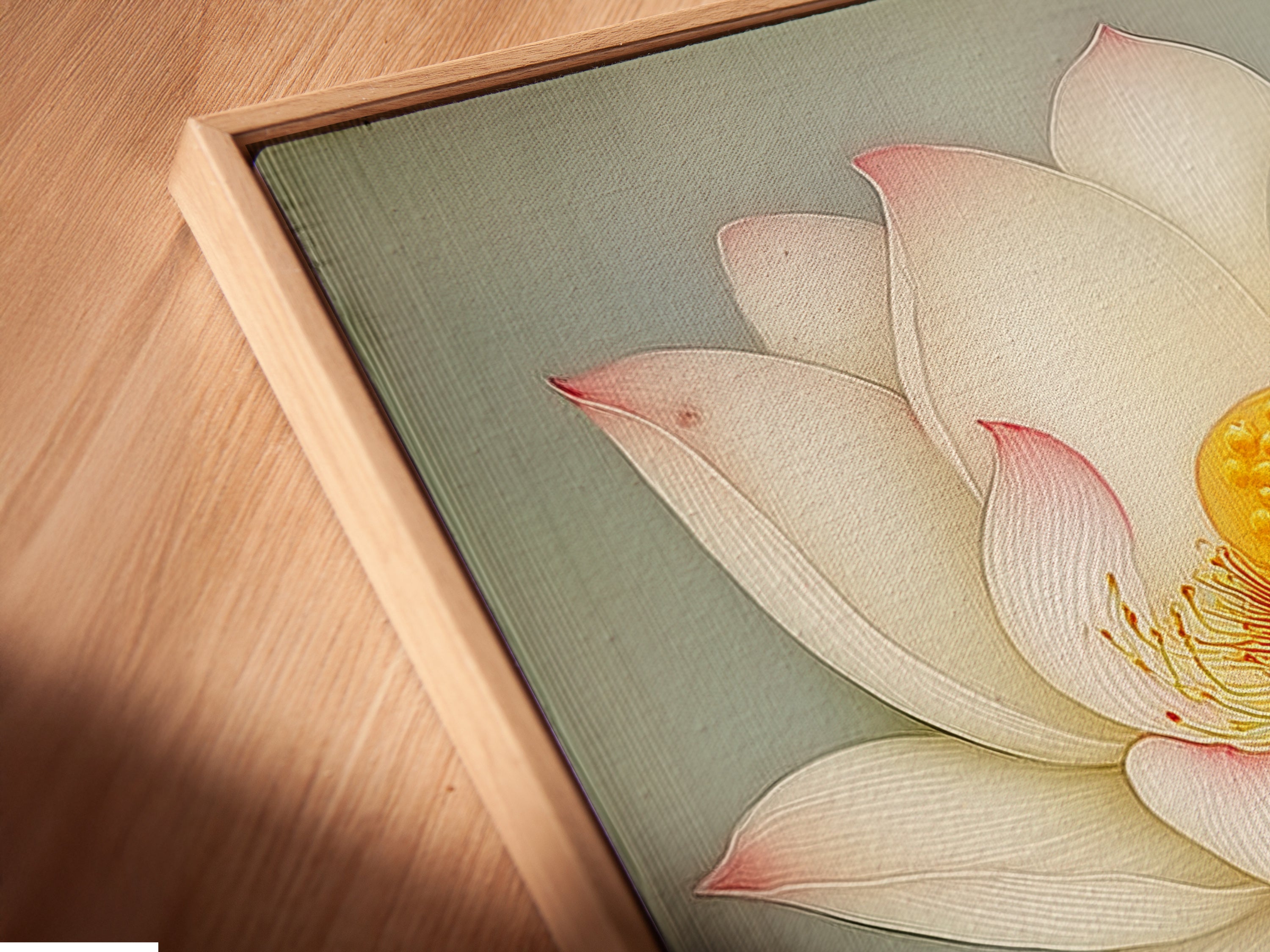 A close-up angled view of a canvas print in a floating frame. This Lotus Flower artwork appears to hover. The floating frame adds a contemporary touch. It enhances the depth and dimension of the floral print. Perfect for modern homes.