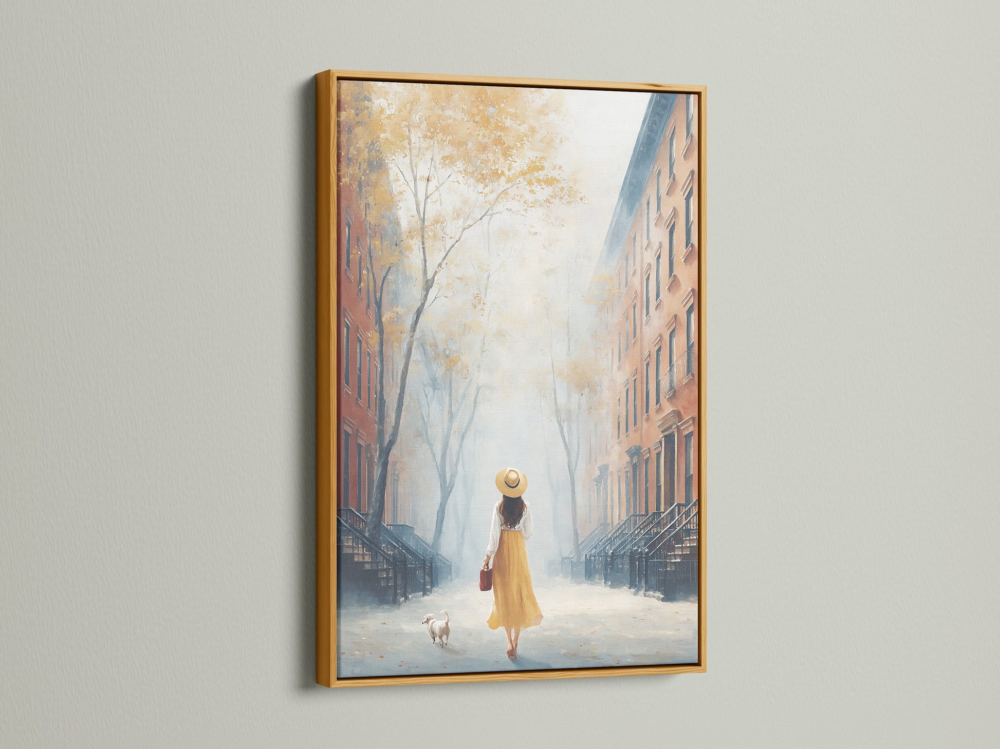 City Stroll Canvas Print is presented in a gold frame. It adds a touch of elegance to the artwork. The cityscape print features a woman and dog in golden tones. This neutral wall art is perfect for entryway decor. The impressionist style enhances any space. A great piece for art collectors and boutique owners.
