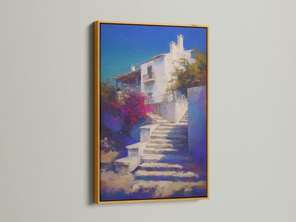 Mediterranean Village artwork with a gold frame. The Greek Island staircase print is beautiful coastal wall decor. Blue and white artwork creates a luxurious feel in a bedroom. Gold frame adds elegance.