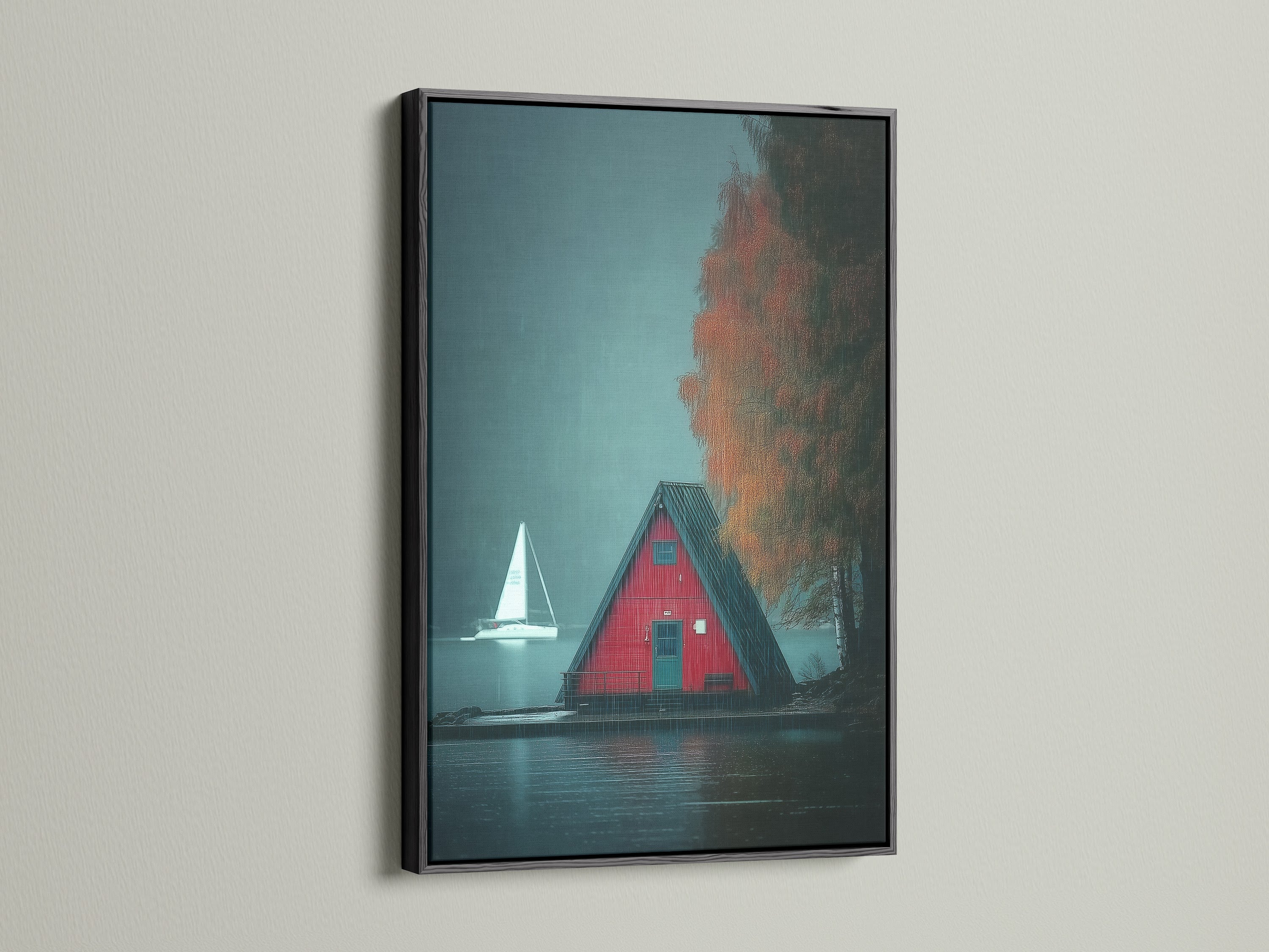 A-Frame Cabin Canvas artwork with a black frame is displayed. The artwork presents a moody lake landscape ideal for cottagecore decor. The red cabin print adds a striking contrast. Perfect for creating a cozy and stylish space in your home. A great piece of cabin artwork and nature print.