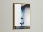Anchor nautical artwork in a gold frame. This coastal artwork enhances any space with a navy blue ocean theme. Perfect for homeowners renters and interior designers. This piece is ideal for bathroom living room bedroom or home offices. Add a touch of maritime print to your walls.