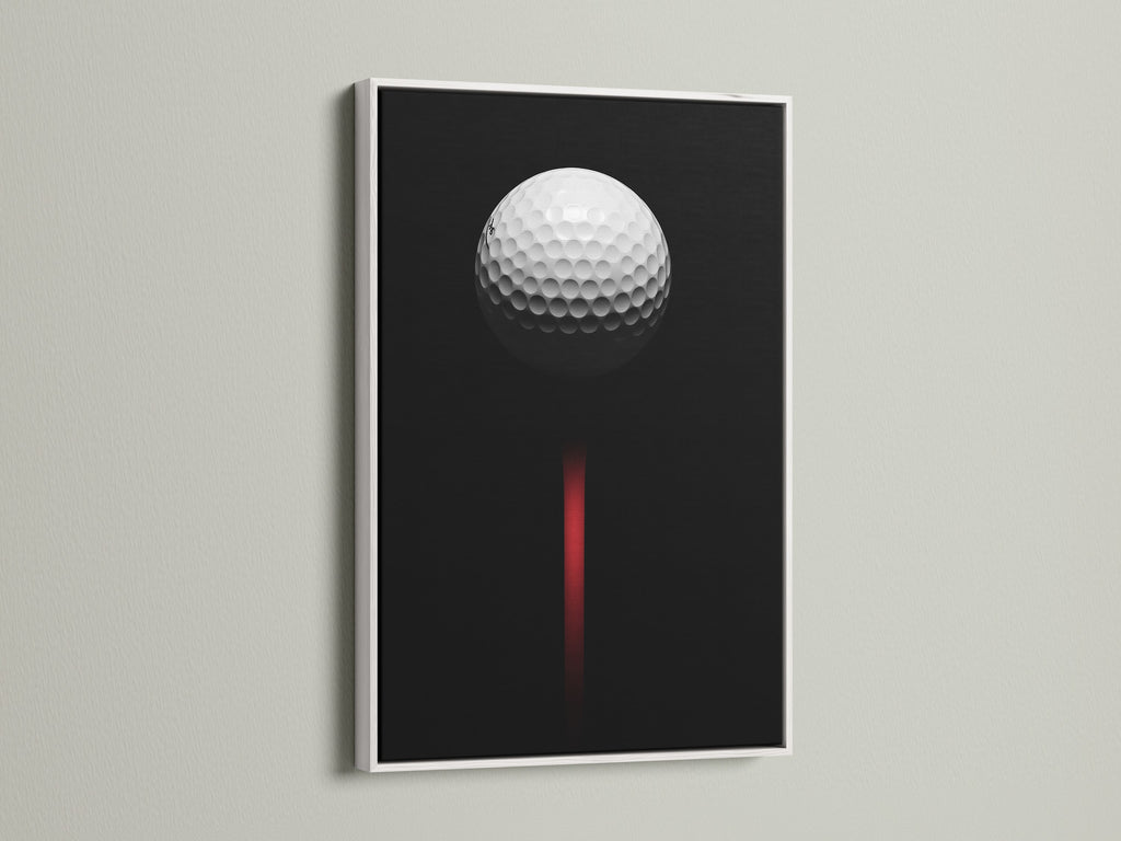 Golf ball artwork displayed in a white frame. This minimalist golf art is perfect for a modern space. The black and red colors add a touch of sophistication.  A great golf lover gift.