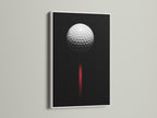 Golf ball artwork displayed in a white frame. This minimalist golf art is perfect for a modern space. The black and red colors add a touch of sophistication.  A great golf lover gift.
