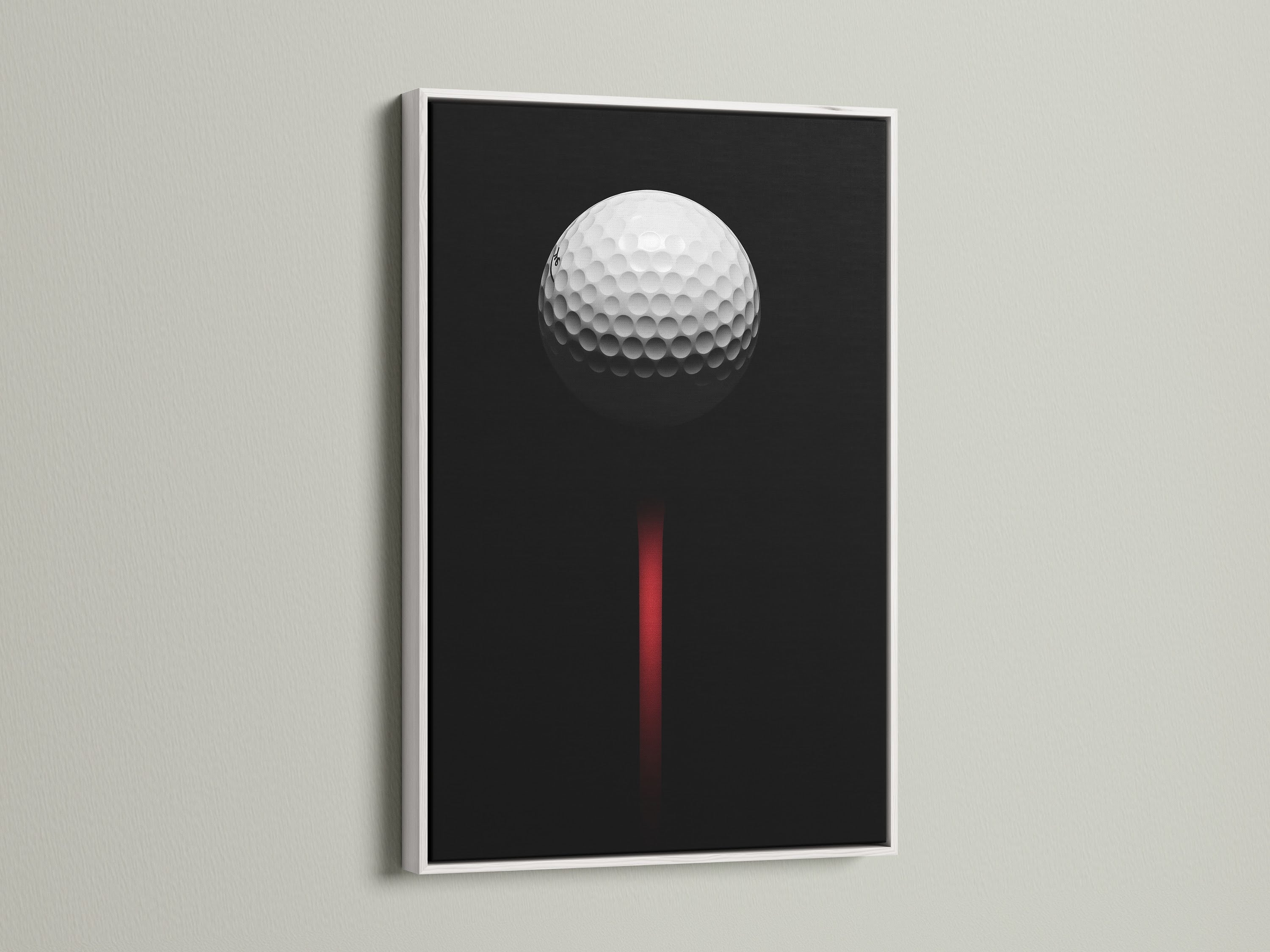 Golf ball artwork displayed in a white frame. This minimalist golf art is perfect for a modern space. The black and red colors add a touch of sophistication.  A great golf lover gift.