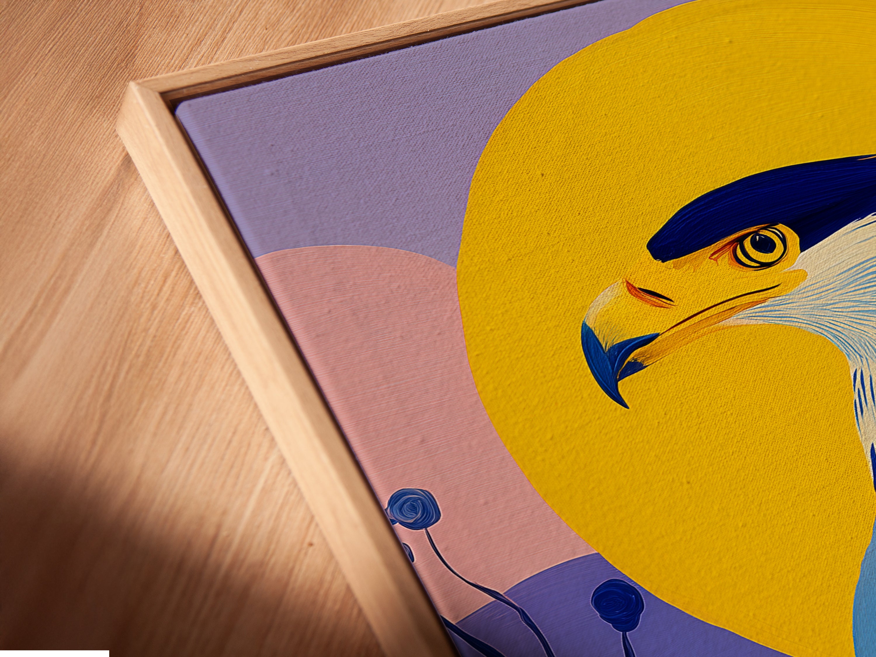 A close-up angled view reveals a canvas print in a floating frame. The colorful eagle art is a contemporary piece. Add a modern touch to your home decor. It's a unique gift for bird art enthusiasts.