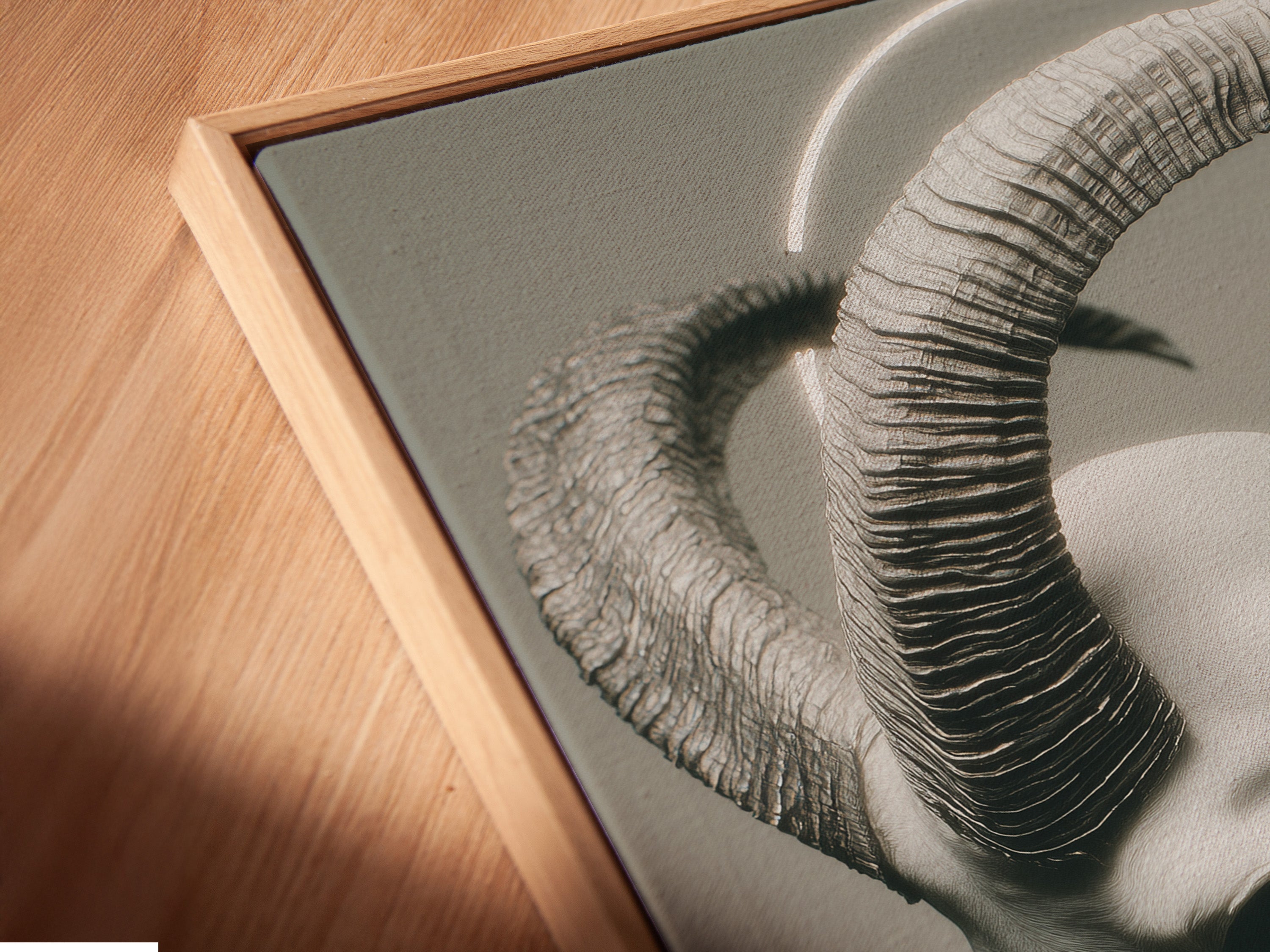 Angled close up of the Gothic Horned Figure Art canvas print. The artwork is displayed in a floating frame. The frame enhances the surreal portrait. It adds depth to the dark art print and occult decor.