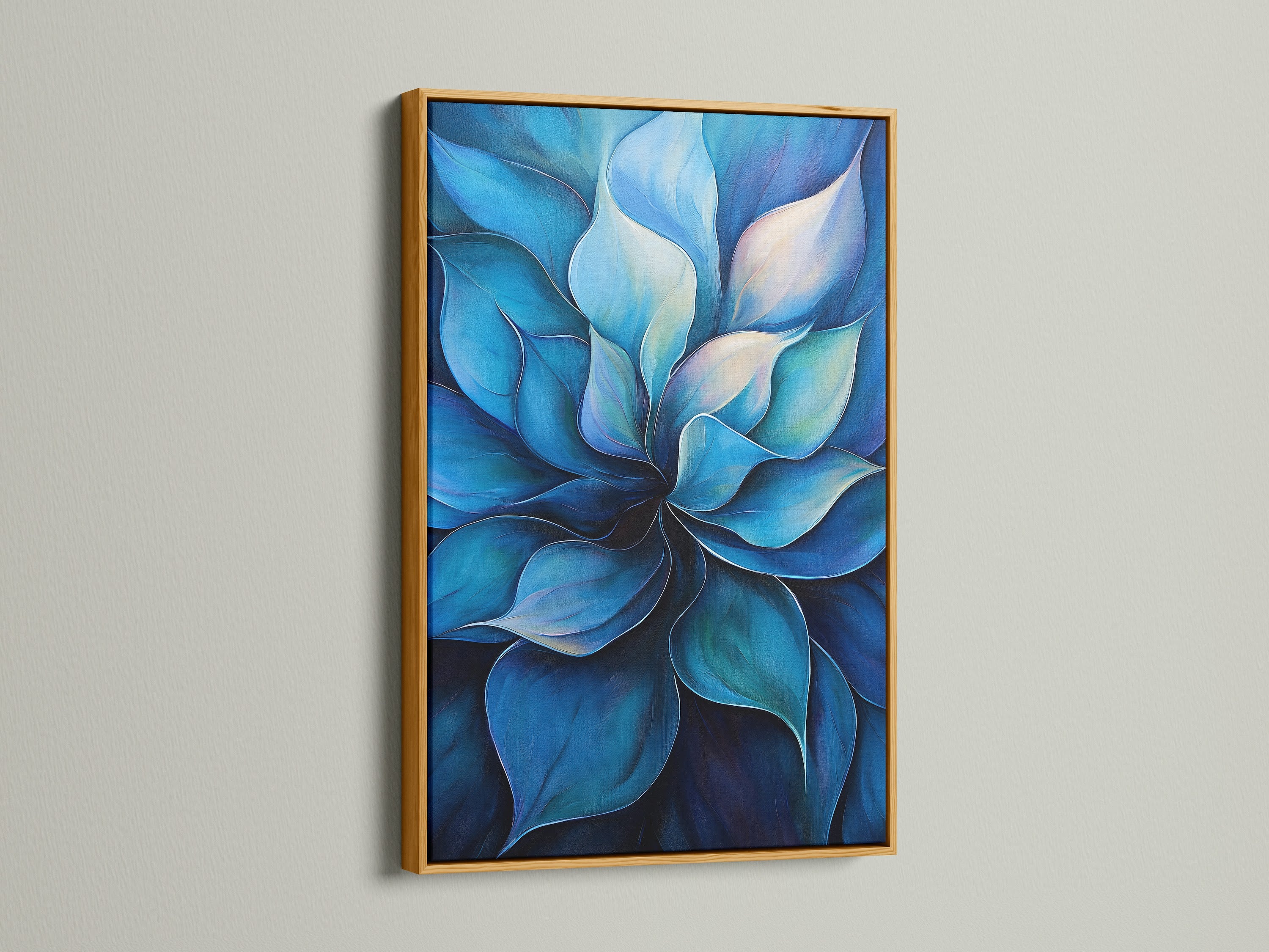This is a blue flower artwork with a gold frame. The gold frame adds a luxurious touch to the piece. This botanical canvas print is perfect for adding a touch of glamour. It is ideal for living rooms and lobbies. The gold frame enhances the contemporary style of the floral painting.