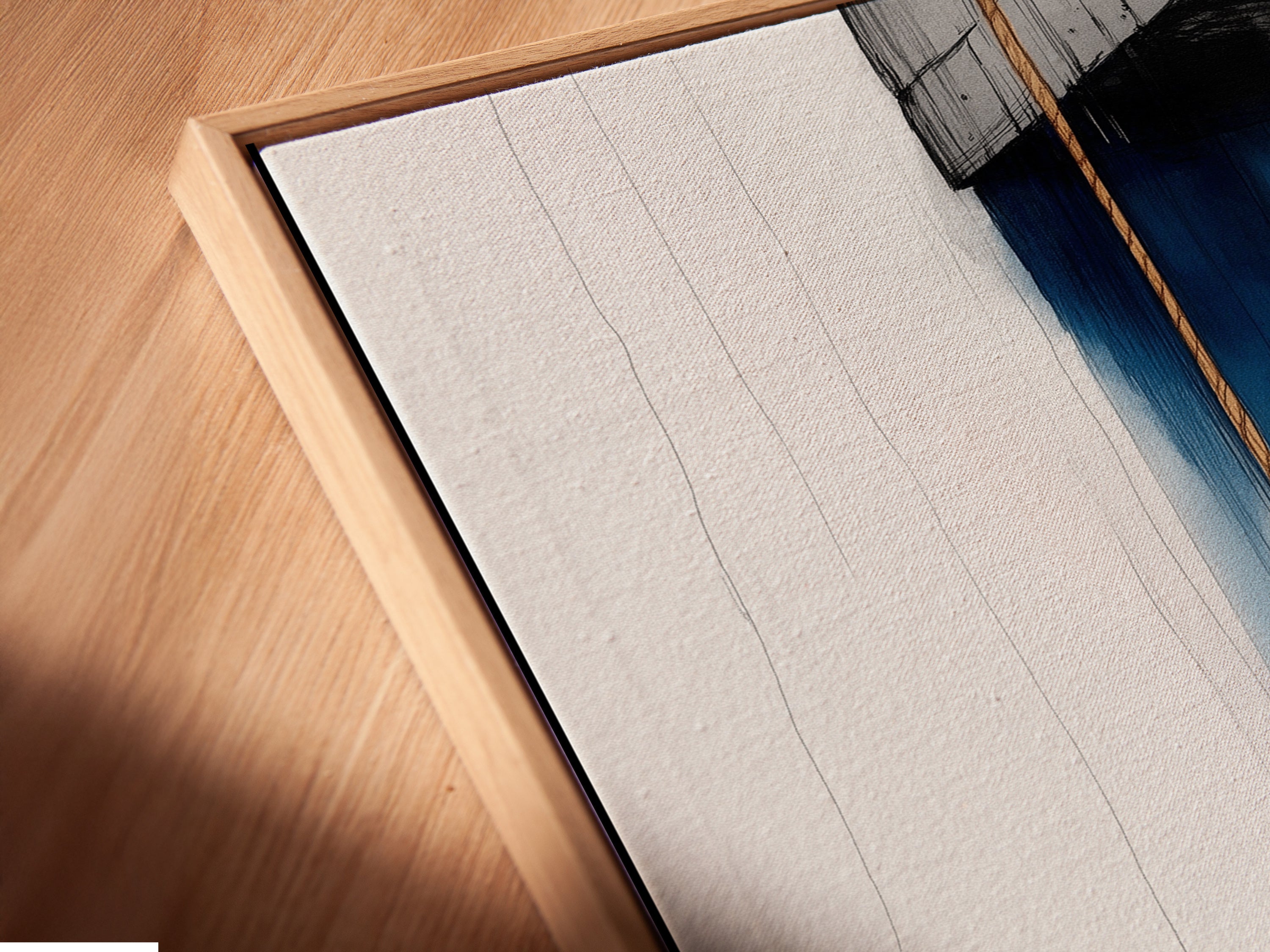 A close-up of a canvas print in a floating frame showcasing anchor nautical artwork. This coastal artwork adds a navy blue ocean theme to any room. Perfect for homeowners renters and interior designers. Ideal for bathroom living room bedroom or home offices. Elevate your space today.