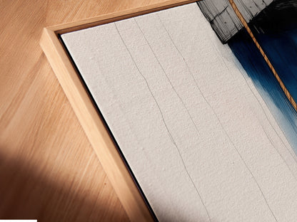 A close-up of a canvas print in a floating frame showcasing anchor nautical artwork. This coastal artwork adds a navy blue ocean theme to any room. Perfect for homeowners renters and interior designers. Ideal for bathroom living room bedroom or home offices. Elevate your space today.