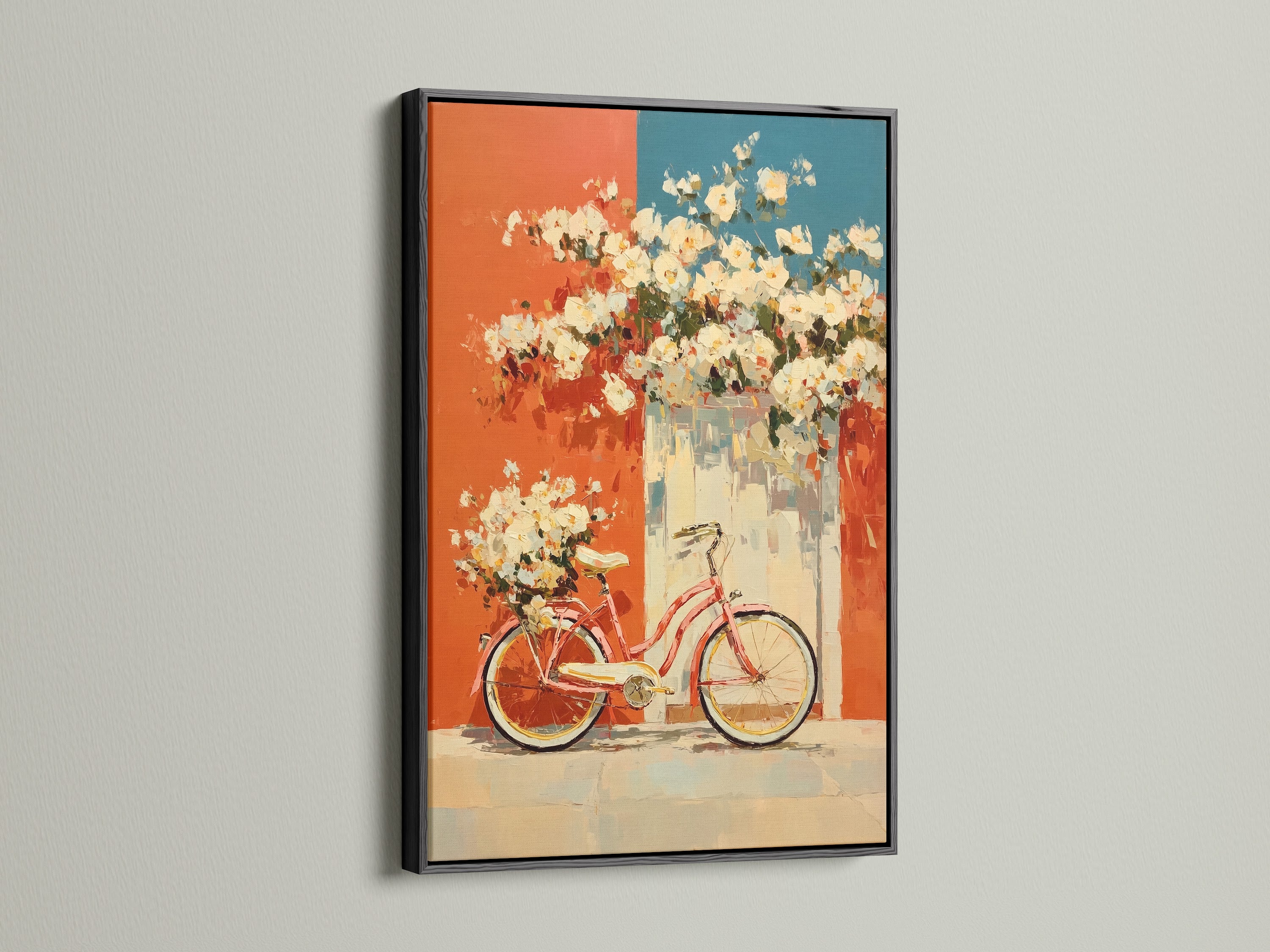 Vintage bicycle artwork displayed in a black frame. The artwork features floral accents in coral and teal. This retro poster adds a touch of mid-century style to any kitchen or living room. The black frame provides a bold and contemporary feel. This artwork is perfect for adding a distinctive touch to your home decor.