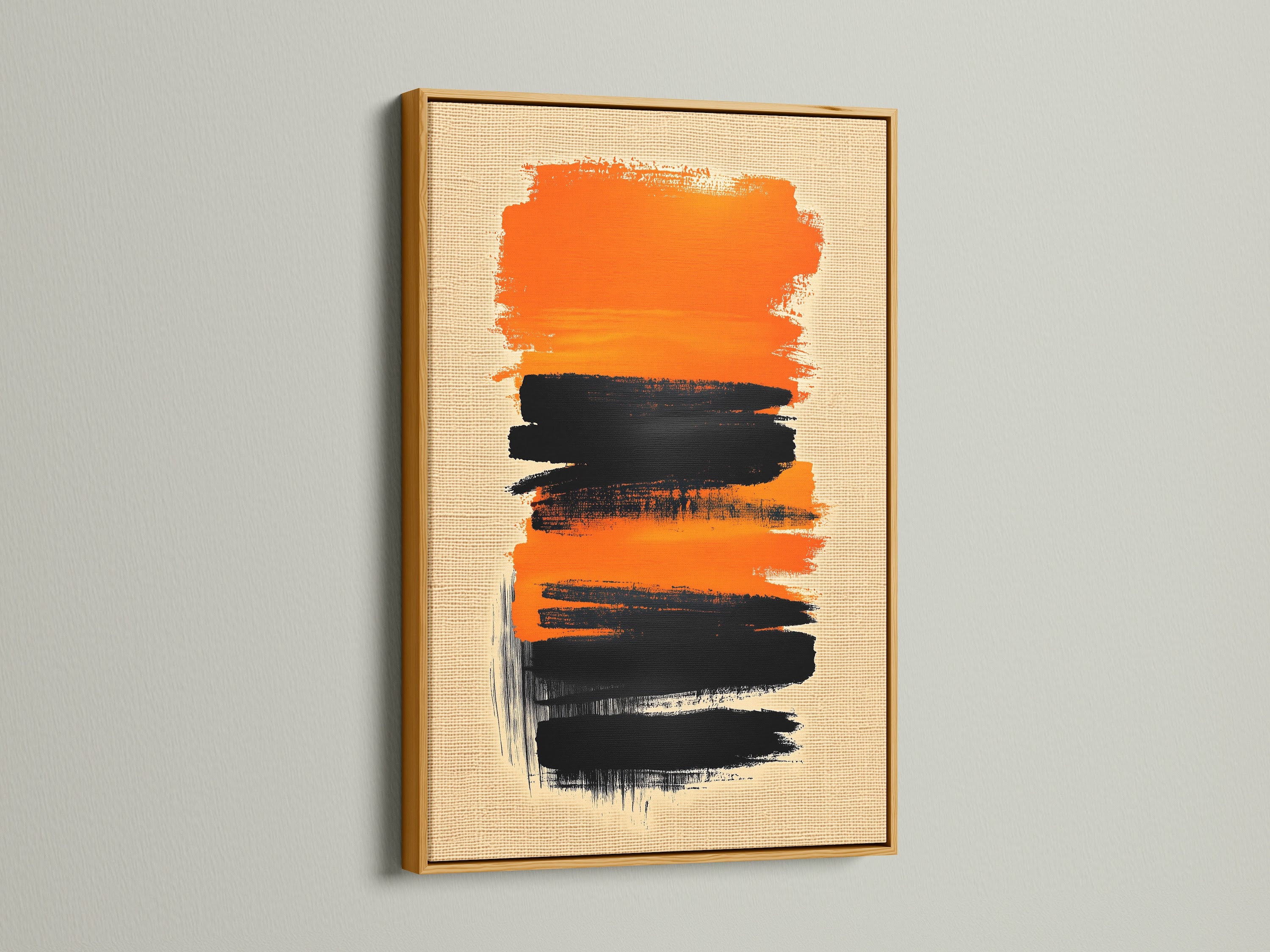 The Abstract Brush Stroke Art is presented in a gold frame. The artwork features a textured black and orange design. This modern canvas art makes a luxurious addition to any space. It adds warmth and sophistication.