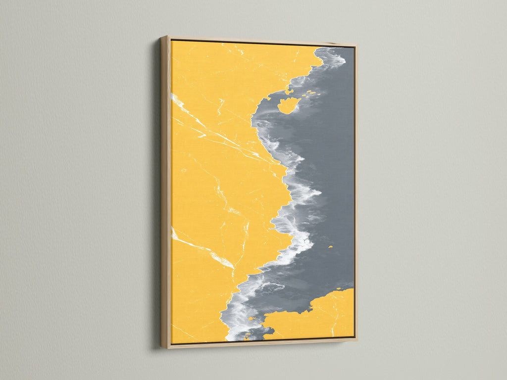 Abstract Coastline Canvas Print in an Oak Frame. The modern artwork combines mustard yellow and gray tones. It creates a stylish seascape art piece for any room. Enhance your space with this unique coastal artwork.