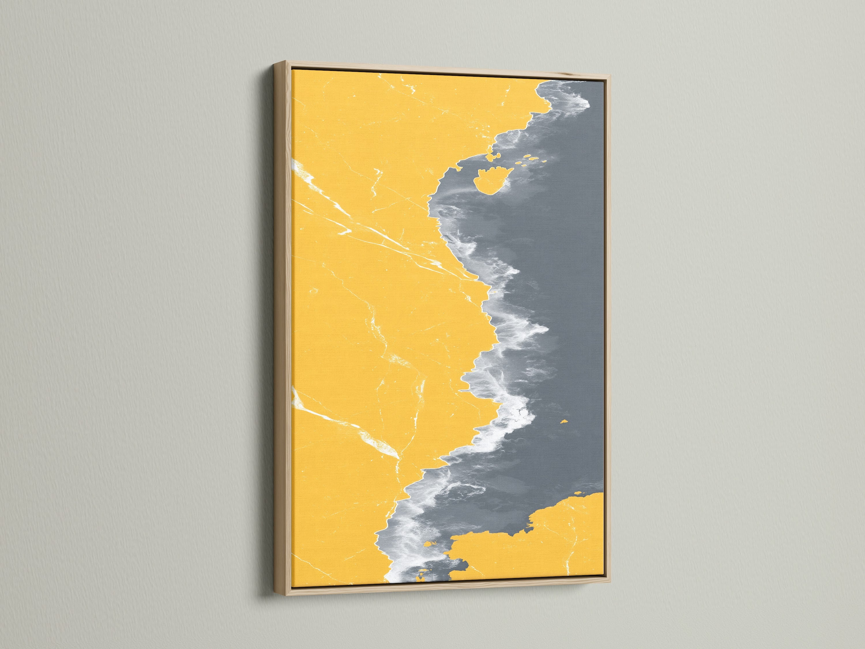 Abstract Coastline Canvas Print in an Oak Frame. The modern artwork combines mustard yellow and gray tones. It creates a stylish seascape art piece for any room. Enhance your space with this unique coastal artwork.