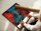 A woman is carefully rolling a fine art poster paper. She is preparing it for framing or display. High-quality poster paper ensures vibrant and lasting artwork. Discover the possibilities of fine art prints. Elevate your art collection with posters.