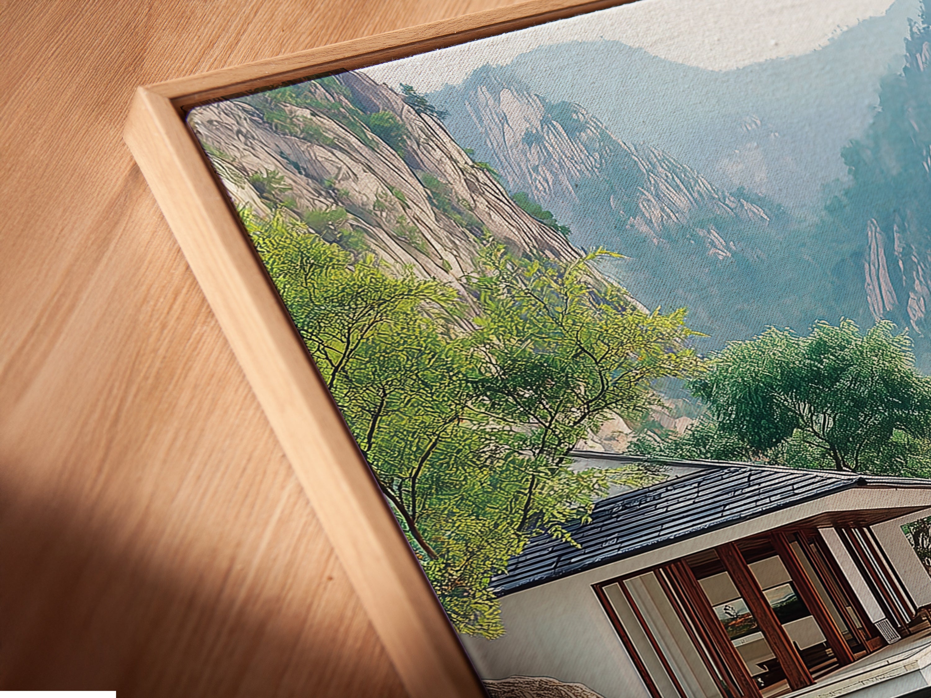 Angled close-up of a Japanese Zen Garden canvas print. It is displayed in a floating frame. The floating frame gives a modern touch to this Asian landscape. See the details of the serene mountain artwork. It is perfect for any contemporary space.