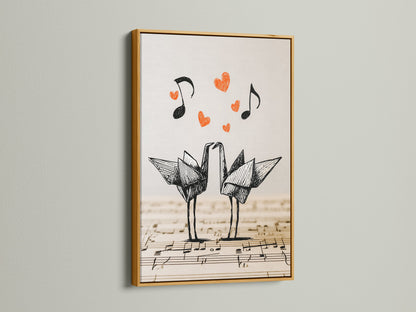 Artwork of origami cranes in a gold frame. The artwork showcases two origami cranes on a music sheet background. Red hearts and music notes accent the piece. The gold frame adds a touch of elegance.