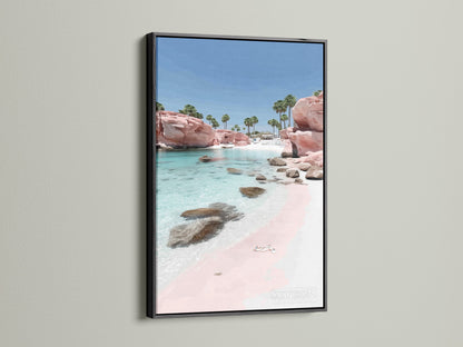 Pink Sand Beach artwork with a black frame. The black frame creates a striking contrast. This coastal artwork highlights the pink sand beach and turquoise waters. Ideal ocean wall art.