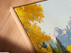 A close-up angled view of a canvas print in a floating frame. The mountain river artwork features an autumn landscape with yellow trees. The floating frame enhances the art. Perfect for modern and rustic interiors.